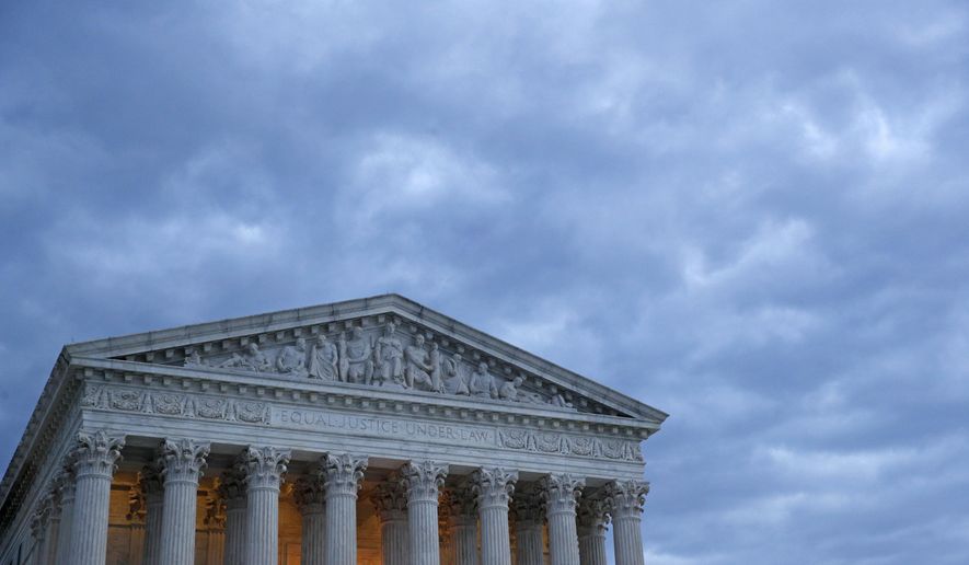 In this Sunday, May 3, 2020 photo, clouds roll over the Supreme Court at dusk on Capitol Hill in Washington. On Monday, May 4, the Supreme Court for the first time audio of court&#x27;s arguments will be heard live by the world and the first arguments by telephone. (AP Photo/Patrick Semansky)