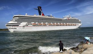 In this Monday, March 9, 2020 photo, the Carnival Liberty leaves Port Canaveral, Fla. Carnival Cruise Line announced the suspension of all of their cruises in North America through April 9, 2020, in response to the coronavirus threat. (Joe Burbank/Orlando Sentinel via AP)