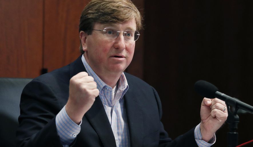 Republican Gov. Tate Reeves gestures Monday, May 4, 2020, in Jackson, Miss., as he wonders how needy state residents are being helped when lawmakers passed a bill May 1, that takes control of the federal CARES Act money, during his daily update on the state's response to COVID-19. (AP Photo/Rogelio V. Solis)