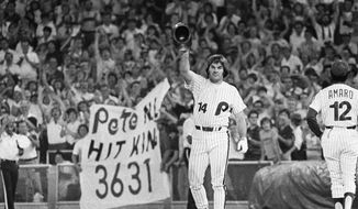  In this Aug. 10, 1981, file photo, Philadelphia Phillies&#39; Phillies Pete Rose waves to the crowd while standing on first base after breaking the National League&#39;s all-time career hitting record in 8th inning of a baseball game against the St. Louis Cardinals in Philadelphia. (AP Photo/File)  **FILE**
