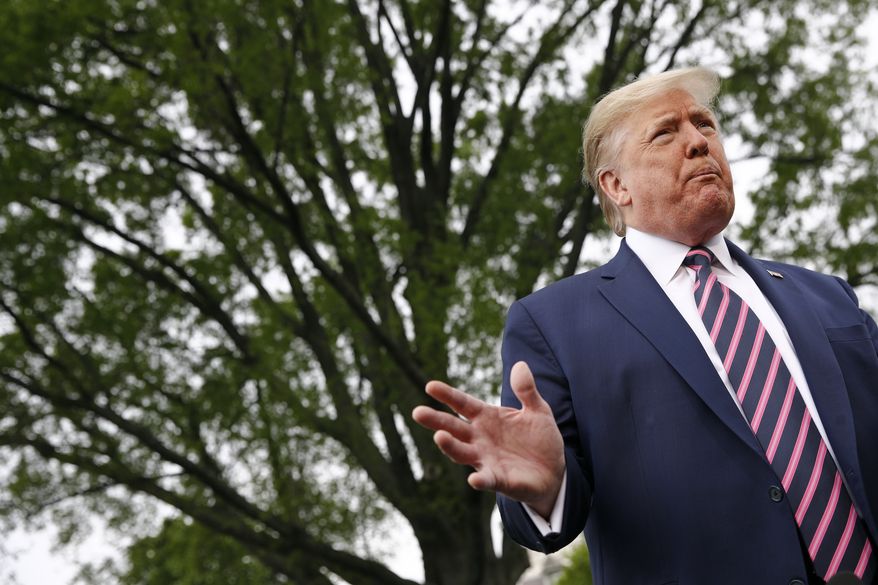 President Donald Trump speaks to members of the media on the South Lawn of the White House in Washington, Tuesday, May 5, 2020, before boarding Marine One for a short trip to Andrews Air Force Base, Md., and then on to Phoenix, Ariz. (AP Photo/Patrick Semansky)