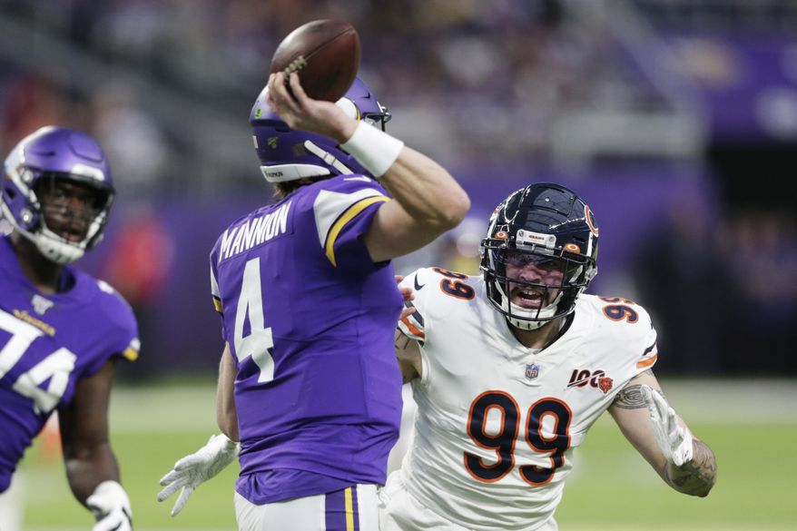 FILE - In this Dec. 29, 2019, file photo, Chicago Bears outside linebacker Aaron Lynch (99) pressures Minnesota Vikings quarterback Sean Mannion (4) during the second half of an NFL football game in Minneapolis. Veteran pass rusher Aaron Lynch signed a one-year contract with Jacksonville on Tuesday, May 5, 2020, giving the Jaguars more depth in case disgruntled defender Yannick Ngakoue decides to skip part of the season.(AP Photo/Andy Clayton-King, File)