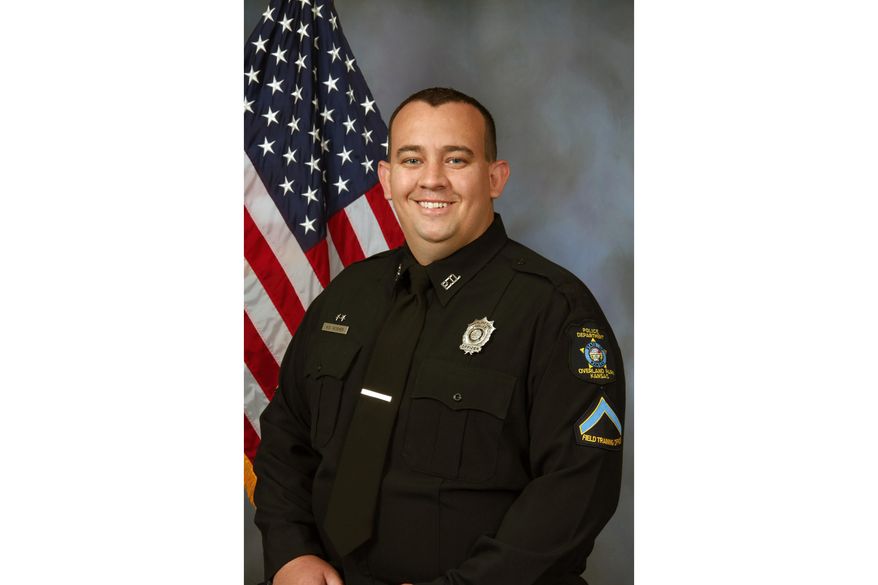 This photo provided by the Overland Park Police Department shows Overland Park Police Officer Mike Mosher. Police in Kansas say a shootout has left both a police officer and a hit-and-run suspect dead. Overland Park Police Chief Frank Donchez says Officer Mike Mosher died at a hospital Sunday, May 3, 2020. (Overland Park Police Department via AP)