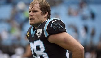 FILE - In this Dec. 29, 2019, file photo, Carolina Panthers tight end Greg Olsen warms up prior to the team&#39;s NFL football game against the New Orleans Saints in Charlotte, N.C. Released by Carolina in late January, Olsen eventually signed a $7 million, one-year deal with the Seattle Seahawks in February after considering Washington and Buffalo as other potential landing spots. (AP Photo/Mike McCarn, File)