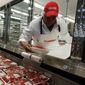 In this Dec. 8, 2009 file photo, a butcher places beef on display at Costco in Mountain View, Calif. (AP Photo/Paul Sakuma, file)  **FILE**