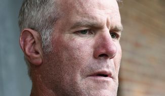 FILE - In this Oct. 17, 2018, file photo, former NFL quarterback Brett Favre speaks with reporters in Jackson, Miss., about his support for Willowood Developmental Center, a facility that provides training and assistance for special needs students, The Mississippi state auditor said Wednesday, May 6, 2020, that Favre is repaying $1.1 million he received for multiple speaking engagements where auditor’s staffers said Favre did not show up. An audit of the Mississippi Department of Human Services, released May 4, said a nonprofit group used welfare money to pay Favre for $500,000 in December 2017 and $600,000 in June 2018. Favre is not charged with any wrongdoing. (AP Photo/Rogelio V. Solis, File)  **FILE**