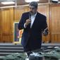 This photo released by the Venezuelan Miraflores presidential press office shows President Nicolas Maduro speaking over military equipment that he says was seized during an incursion into Venezuela, during his televised address from Miraflores in Caracas, Venezuela, Monday, May 4, 2020. Maduro said authorities arrested two U.S. citizens among a group of “mercenaries” on Monday, a day after a beach raid purportedly aimed at capturing the leader that Venezuelan authorities say they foiled. (Miraflores press office via AP)
