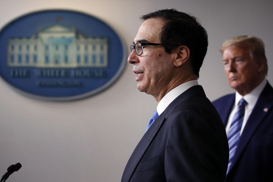 In this April 21, 2020, file photo President Donald Trump listens as Treasury Secretary Steven Mnuchin speaks about the coronavirus in the James Brady Press Briefing Room of the White House in Washington. More than 40 public companies are pledging to return money to the government&#39;s small business coronavirus fund now that Mnuchin is threatening criminal prosecutions for violating the rules of the program. (AP Photo/Alex Brandon, File)
