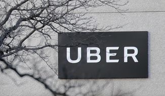 FILE - In this Nov. 15, 2019, file photo an Uber office is seen in Secaucus, N.J. Uber lost $2.9 billion in the first quarter as its overseas investments were hammered by the coronavirus pandemic. (AP Photo/Seth Wenig, File)