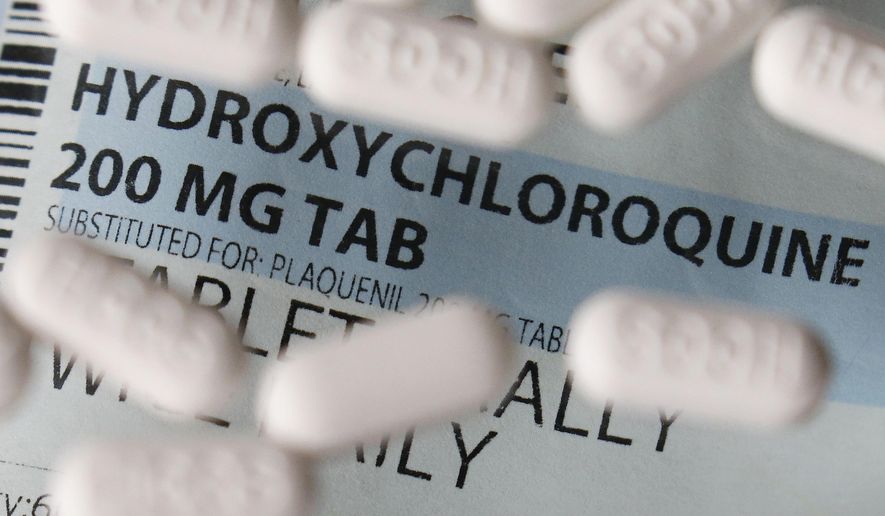 This Monday, April 6, 2020 file photo shows an arrangement of hydroxychloroquine tablets in Las Vegas. (AP Photo/John Locher)