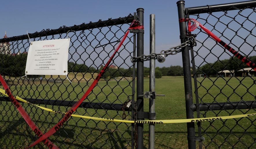 The gates of St. Edwards&#39; Lewis-Chen Family Soccer Field are locked and marked closed due to the coronavirus outbreak, Tuesday, May 5, 2020, in Austin, Texas. In response to the economic impact of COVID-19, St. Edwards says they are cutting cut six sports programs including men&#39;s and women&#39;s tennis, men&#39;s and women&#39;s golf and men&#39;s soccer. (AP Photo/Eric Gay)