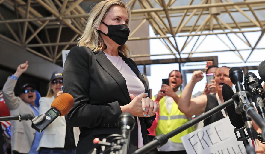 Salon owner Shelley Luther begins to speak to the media after she was released from jail in Dallas, Thursday, May 7, 2020. Luther was jailed for refusing to keep her business closed amid concerns of the spread of COVID-19. (AP Photo/LM Otero)