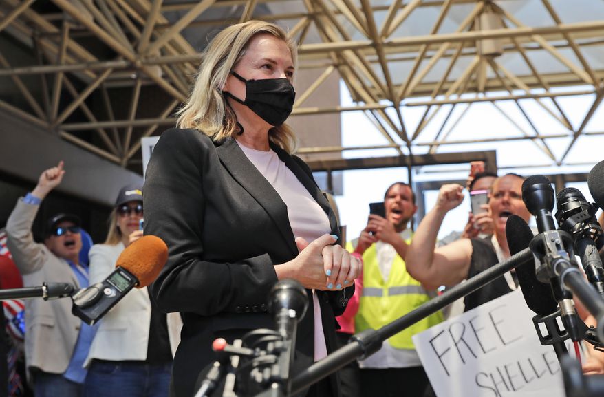 Salon owner Shelley Luther begins to speak to the media after she was released from jail in Dallas, Thursday, May 7, 2020. Luther was jailed for refusing to keep her business closed amid concerns of the spread of COVID-19. (AP Photo/LM Otero)