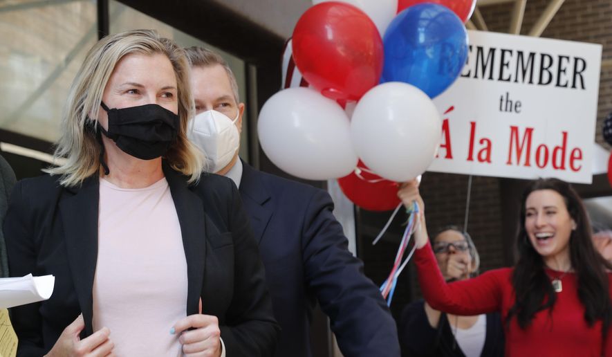 Salon owner Shelley Luther, left, walks over to speak to the media and supporters after she was released from jail in Dallas, Thursday, May 7, 2020. Luther was jailed for refusing to keep her business closed amid concerns of the spread of COVID-19. (AP Photo/LM Otero)