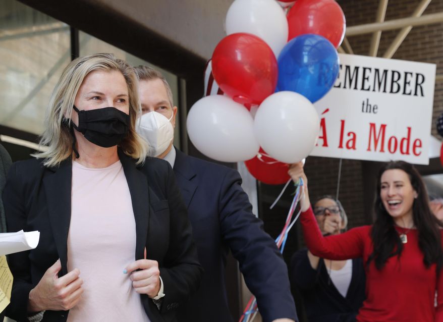 Salon owner Shelley Luther, left, walks over to speak to the media and supporters after she was released from jail in Dallas, Thursday, May 7, 2020. Luther was jailed for refusing to keep her business closed amid concerns of the spread of COVID-19. (AP Photo/LM Otero)