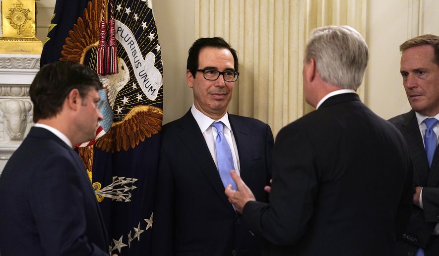 Treasury Secretary Steven Mnuchin, second from left, talks with House Minority Leader Kevin McCarthy of Calif., second from right, prior to a meeting between President Donald Trump and Republican lawmakers in the State Dining Room of the White House, Friday, May 8, 2020, in Washington. (AP Photo/Evan Vucci)