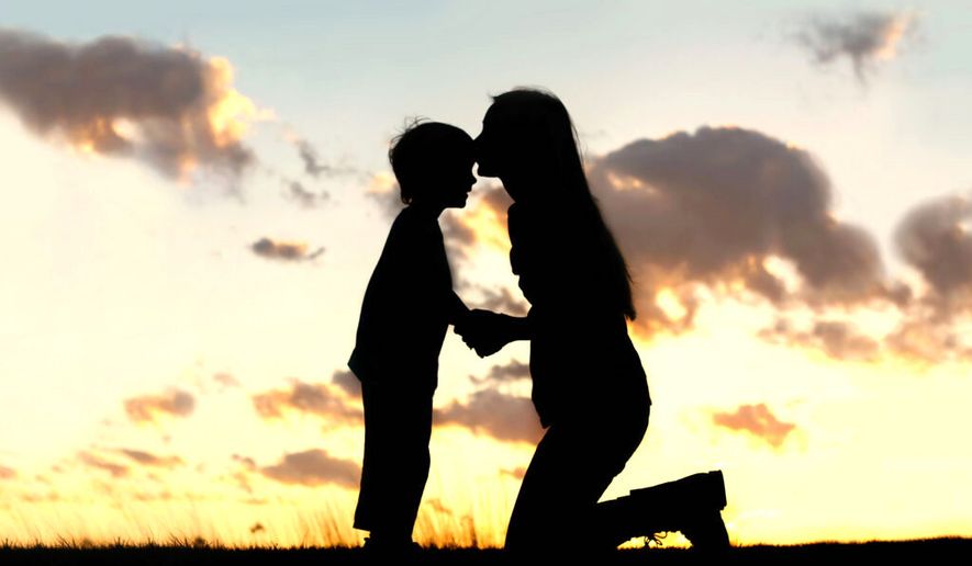 Mother and child, a classic silhouette. (Image from Shutterstock/file)