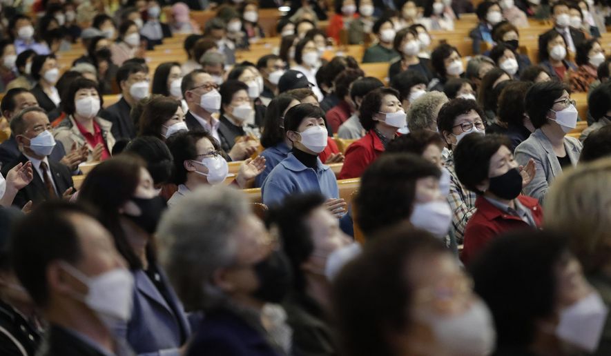 Christians wearing face masks attend a service at the Yoido Full Gospel Church in Seoul, South Korea, Sunday, May 10, 2020. South Korea's President Moon Jae-in urged citizens not to lower their guard down, but said there's no reason to be panicked amid worries about a new surge in the coronavirus outbreak in the country.(AP Photo/Ahn Young-joon)