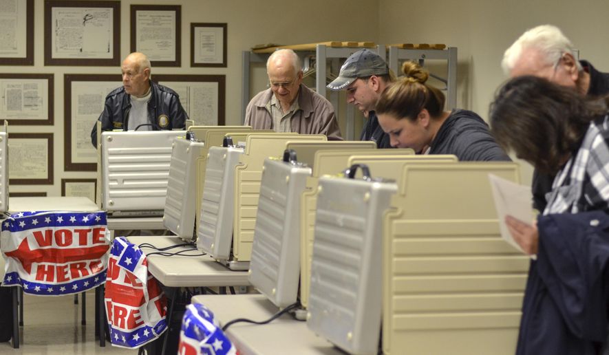 FILE - In this Nov. 5, 2018 file photo, voters packed the Vigo County Annex in Terre Haute, Ind., during the final day of early voting. Many of Indiana's voters have shifted over the past decade to casting ballots days or weeks ahead of Election Day rather than standing in line at their neighborhood polling site on that day. The coronavirus outbreak is causing what could become an even bigger shift toward mail-in ballots for Indiana's upcoming primary election that's been delayed until June 2, 2020. (Austen Leake/Tribune-Star via AP File)