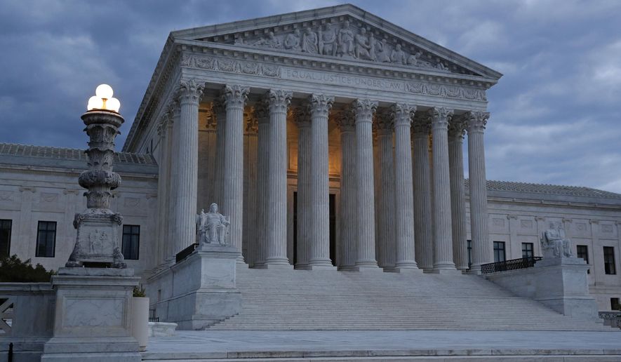 FILE - In this May 3, 2020, file photo, clouds roll over the Supreme Court at dusk on Capitol Hill in Washington. Trump is hoping to persuade a Supreme Court with two of his appointees to keep his tax and other financial records from being turned over to lawmakers and a New York district attorney. The justices are hearing arguments by telephone Tuesday, May 12. (AP Photo/Patrick Semansky, File)