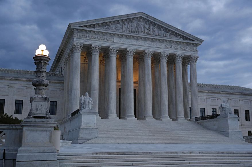 FILE - In this May 3, 2020, file photo, clouds roll over the Supreme Court at dusk on Capitol Hill in Washington. Trump is hoping to persuade a Supreme Court with two of his appointees to keep his tax and other financial records from being turned over to lawmakers and a New York district attorney. The justices are hearing arguments by telephone Tuesday, May 12. (AP Photo/Patrick Semansky, File)