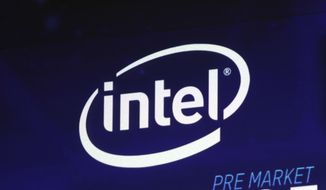 In this Oct. 3, 2018, file photo the Intel logo appears on a screen at the Nasdaq MarketSite, in New York&#39;s Times Square. (AP Photo/Richard Drew, File)