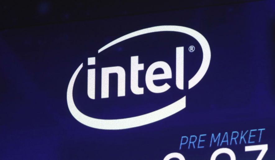 FILE - In this Oct. 3, 2018, file photo the Intel logo appears on a screen at the Nasdaq MarketSite, in New York&#39;s Times Square. Intel is talking to the Trump administration about building a new semiconductor plant in the United States amid concern about relying on suppliers in Asia for chips used in a wide variety of electronics. (AP Photo/Richard Drew, File)