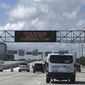 Cars travel along the Dolphin Expressway, Monday, May 11, 2020, in downtown Miami. Americans are slowly getting back on the road after hunkering down amid the cornonavirus pandemic, though driving still is well below what it was before many states issued stay-at-home orders. (AP Photo/Wilfredo Lee)