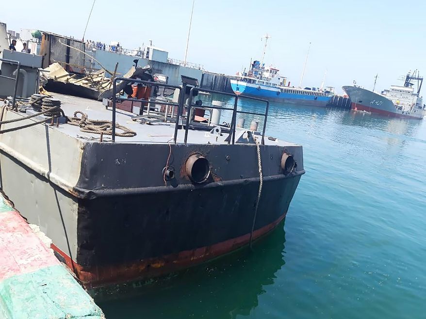 In this photo provided Monday, May 11, 2020, by the Iranian Army, the Konarak support vessel which was struck during a training exercise in the Gulf of Oman, is docked in an unidentified naval base in Iran. An Iranian missile fired during a training exercise in the Gulf of Oman struck a support vessel near its target, killing 19 sailors and wounding 15, Iran's state media reported on Monday, amid heightened tensions between Tehran and the U.S. (Iranian Army via AP) ** FILE **
