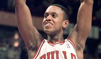 FILE - In this Jan. 5, 2000, file photo, Chicago Bulls&#39; B.J. Armstrong celebrates the Bulls&#39; 77-66 win over the Washington Wizards in Chicago. Armstrong earned three rings with the Chicago Bulls, as part of their NBA championship teams in 1991, 1992 and 1993. (AP Photo/Ted S. Warren,File)