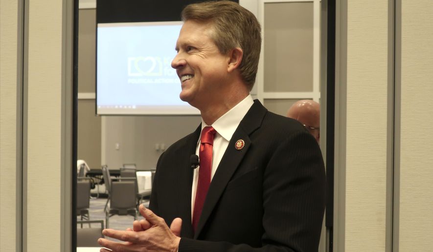 In this Feb. 1, 2020, file photo, U.S. Rep. Roger Marshall, R-Kan., a candidate for the U.S. Senate, awaits the start of a debate in Olathe, Marshall&#39;s critics on the political right are working to hobble the western Kansas congressman&#39;s bid for the U.S. Senate in the final three months of a primary campaign as he fights to overcome conservative immigration hardliner Kris Kobach in a crowded field. (AP Photo/John Hanna File)