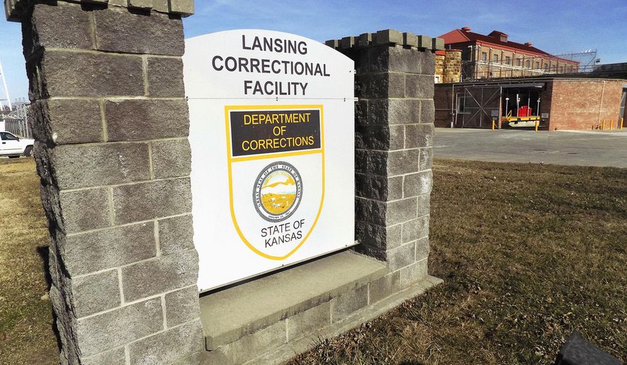FILE - This Feb. 2, 2017, file photo, shows the exterior of the Lansing Correctional Center in Lansing, Kan. A coronavirus outbreak that has sickened hundreds of people at the largest prison in Kansas has claimed the life of a staff member, the state Corrections Department said Tuesday May 12, 2020. Department spokeswoman Rebecca Witte said the Lansing Correctional Facility employee died Monday, but she provided no additional information. (Mark Rountree/Leavenworth Times via AP, File)