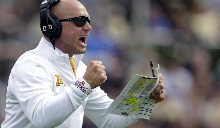 FILE - In this Sept. 28, 2019, file photo, Minnesota head coach P.J. Fleck celebrates a touchdown during the first half of an NCAA college football game against Purdue in West Lafayette, Ind. The coronavirus is preventing prospects from leaving home to visit campuses and is keeping college coaches from traveling to evaluate players across the country. (AP Photo/Michael Conroy, File)