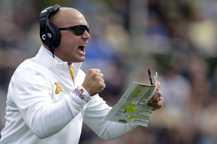 FILE - In this Sept. 28, 2019, file photo, Minnesota head coach P.J. Fleck celebrates a touchdown during the first half of an NCAA college football game against Purdue in West Lafayette, Ind. The coronavirus is preventing prospects from leaving home to visit campuses and is keeping college coaches from traveling to evaluate players across the country. (AP Photo/Michael Conroy, File)