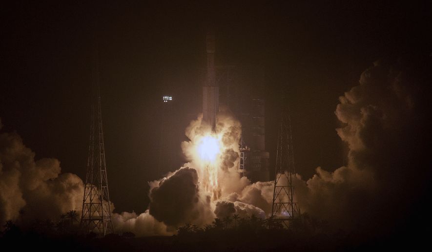 In this photo released by Xinhua News Agency, a Long March 7 rocket carrying the Tianzhou 1 cargo spacecraft blasts off from the Wenchang Space Launch Center in Wenchang in southern China&#39;s Hainan Province, Thursday, April 20, 2017. China has launched its first unmanned cargo spacecraft Thursday on a mission to dock with the country&#39;s space station. (Ju Zhenhua/Xinhua via AP)