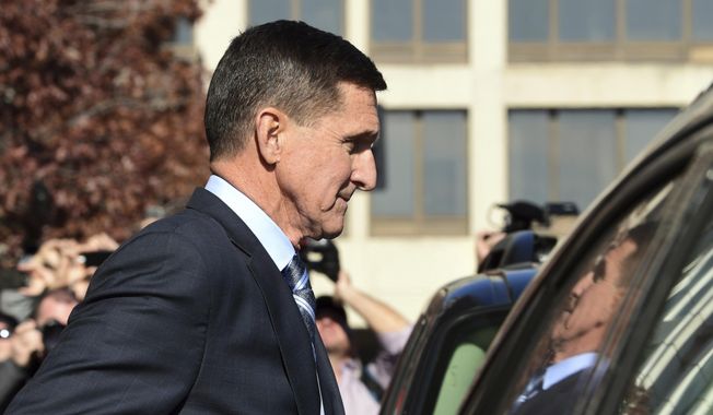In this Dec. 1, 2017, file photo, former President Donald Trump national security adviser Michael Flynn leaves federal court in Washington. Newly released FBI documents show the FBI concluded Mr. Flynn believed he was telling the truth at the time of his interviews with bureau agents. (AP Photo/Susan Walsh, File)