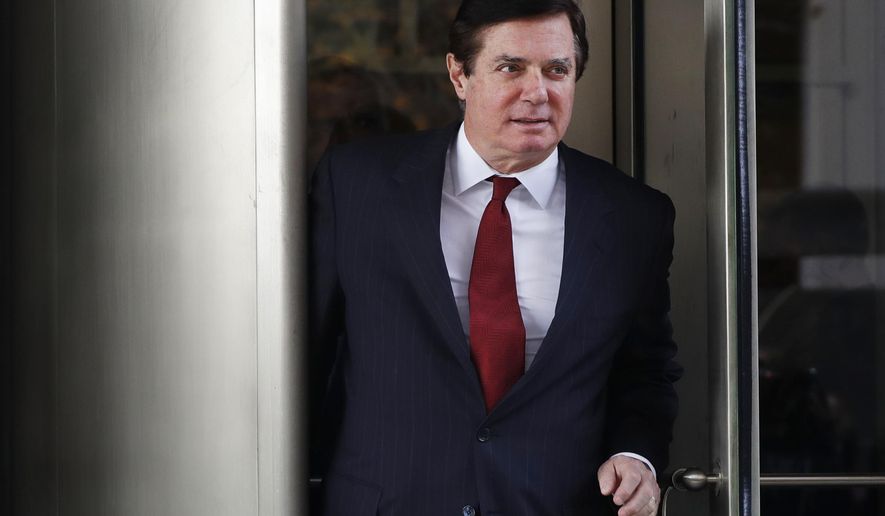 FILE- In this Nov. 6, 2017 file photo, Paul Manafort, President Donald Trump's former campaign chairman, leaves the federal courthouse in Washington. Manafort has been released from federal prison to serve the rest of his sentence in home confinement over concerns about the coronavirus, his lawyer said Wednesday. (AP Photo/Jacquelyn Martin)