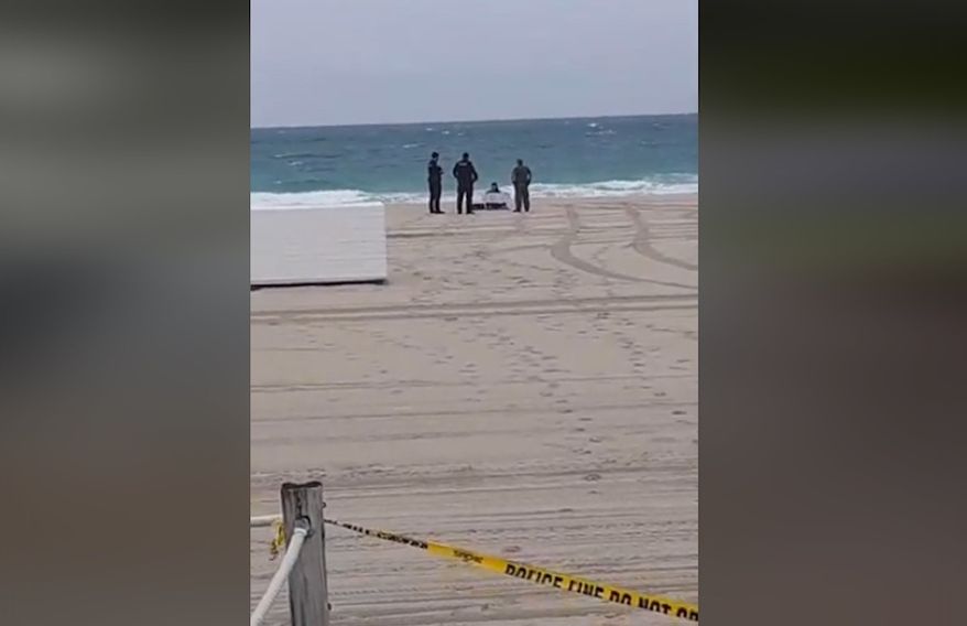 Miami Beach Police on Sunday arrested 33-year-old Kimberly Falkenstine, who was protesting the coronavirus lockdown by holding a "We Are Free" sign on a closed public beach. (screengrab via Facebook)