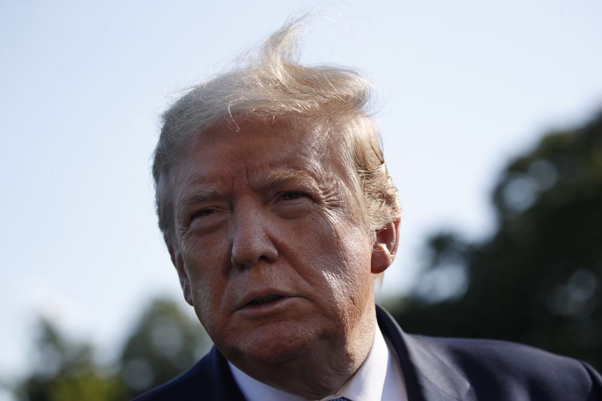 President Donald Trump speaks with reporters as he departs the White House on Marine One, Friday, May 15, 2020, in Washington. Trump is en route to Camp David, Md. (AP Photo/Alex Brandon)