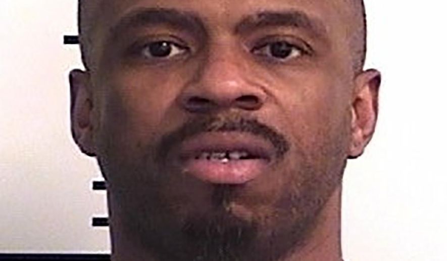 This Friday, May 15, 2020, booking photo provided by the Colorado Department of Corrections shows 40-year-old Cornelius Haney. The man suspected of killing a woman in Denver was released from prison three weeks before the slaying due to concerns over the coronavirus. Haney was released April 15 under powers granted to the Colorado Department of Corrections by Gov. Jared Polis, The Denver Post reported Friday. The governor's order aims to speed up certain releases from the prison system to lower the population amid the pandemic. (Colorado Department of Corrections via The Denver Post via AP)