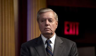 In this March 25, 2020, photo Sen. Lindsey Graham, R-S.C., listens during a news conference about the coronavirus relief bill on Capitol Hill in Washington. (AP Photo/Andrew Harnik) ** FILE **