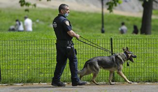 A New York Police Officer patrols Central Park during the coronavirus pandemic Saturday, May 16, 2020, in New York. (AP Photo/Frank Franklin II) **FILE**
