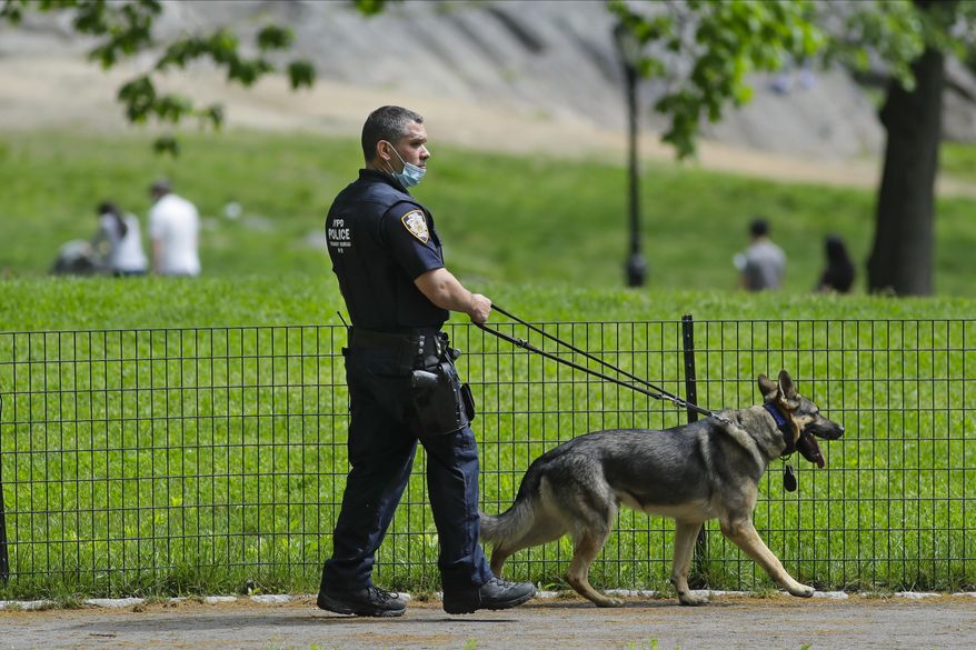 A New York Police Officer patrols Central Park during the coronavirus pandemic Saturday, May 16, 2020, in New York. (AP Photo/Frank Franklin II) **FILE**