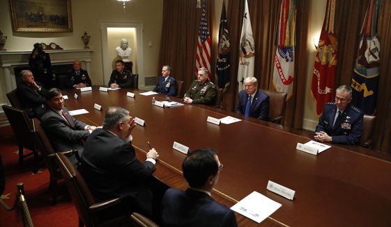President Donald Trump meets with senior military leaders and members of his national security team in the Cabinet Room of the White House, Saturday, May 9, 2020, in Washington. Clockwise from top left, Chief of Space Operations at US Space Force Gen. John Raymond, Chief of Staff of the Army Gen. James McConville, Air Force Chief of Staff Gen. David Goldfein, Chairman of the Joint Chiefs Gen. Mark Milley, Trump, Air Force Gen. John Hyten, Vice Chairman of the Joint Chiefs of Staff, Treasury Secretary Steven Mnuchin, Secretary of State Mike Pompeo, Secretary of Defense Mark Esper and Ret. Lt. Gen. Keith Kellogg, Assistant to the President and National Security Advisor to the Vice President. (AP Photo/Patrick Semansky)