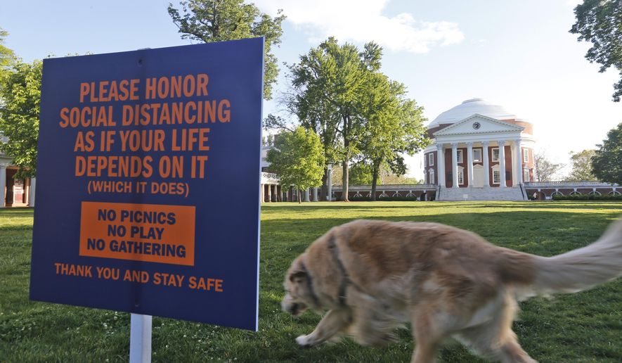 The Lawn at the University of Virginia is desolate on graduation weekend at the school Saturday May 16, 2020, in Charlottesville, Va. The lawn would normally be the scene of the school's graduation with 30,000 people in attendance. (AP Photo/Steve Helber) **FILE**