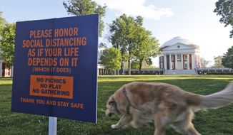 The Lawn at the University of Virginia is desolate on graduation weekend at the school Saturday May 16, 2020, in Charlottesville, Va. The lawn would normally be the scene of the school&#x27;s graduation with 30,000 people in attendance. (AP Photo/Steve Helber) **FILE**