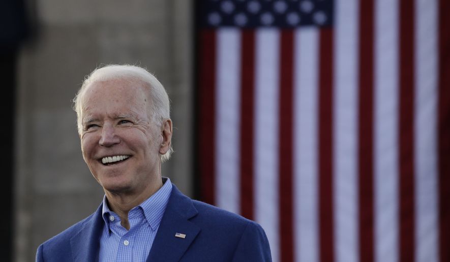 In this March 7, 2020, file photo Democratic presidential candidate former Vice President Joe Biden acknowledges the crowd during a campaign rally in Kansas City, Mo. (AP Photo/Charlie Riedel, File)
