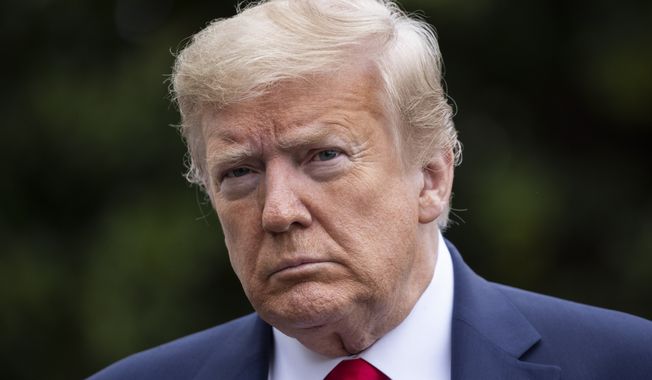 President Donald Trump pauses while speaking with reporters on the South Lawnof the White House in Washington, Sunday, May 17, 2020. Trump is returning from a visit to nearby Camp David, Md. (AP Photo/Alex Brandon)