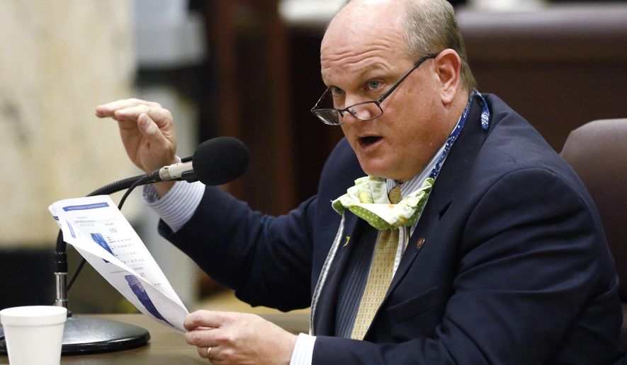 Sen. Brice Wiggins, R-Pascagoula, asks a question of State Health Officer Dr. Thomas Dobbs during a hearing Tuesday, May 12, 2020, at the Capitol in Jackson, Miss. A committee made up of members from the Senate Medicaid and Public Health and Welfare committees heard from a number of healthcare professionals on issues pertaining to COVID-19 and the CARES Act. (AP Photo/Rogelio V. Solis)