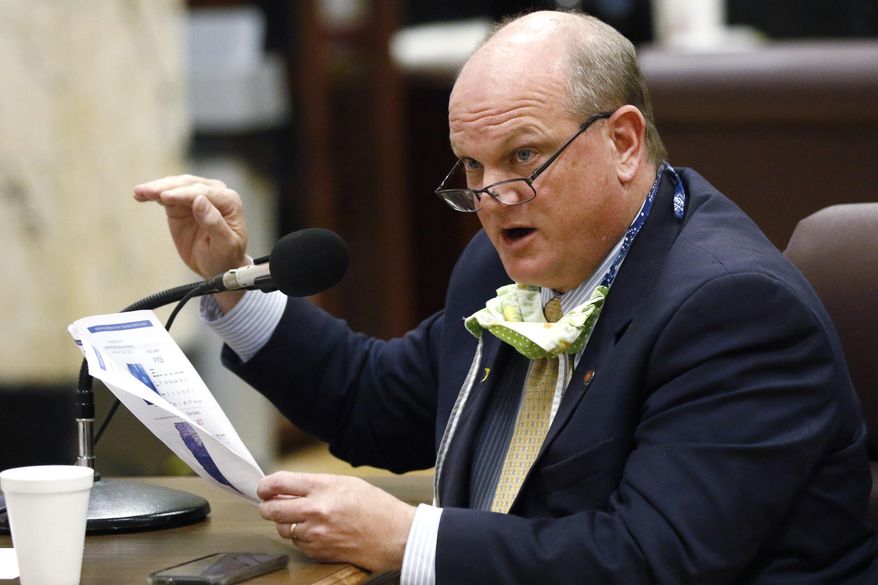 Sen. Brice Wiggins, R-Pascagoula, asks a question of State Health Officer Dr. Thomas Dobbs during a hearing Tuesday, May 12, 2020, at the Capitol in Jackson, Miss. A committee made up of members from the Senate Medicaid and Public Health and Welfare committees heard from a number of healthcare professionals on issues pertaining to COVID-19 and the CARES Act. (AP Photo/Rogelio V. Solis)